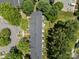Aerial view of townhomes featuring lush landscaping, common areas, and ample parking at 12516 Hennigan Place Ln, Charlotte, NC 28214