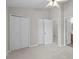 Bedroom featuring neutral tones, a closet, and door to the bathroom at 12516 Hennigan Place Ln, Charlotte, NC 28214