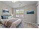 Bright bedroom with natural light, a cozy bed, and tasteful decor at 12516 Hennigan Place Ln, Charlotte, NC 28214
