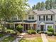 Charming townhome with a landscaped front yard and welcoming entrance at 12516 Hennigan Place Ln, Charlotte, NC 28214
