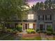 Charming townhome with a landscaped front yard and welcoming entrance at 12516 Hennigan Place Ln, Charlotte, NC 28214