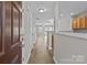 Inviting foyer with wood-look floors leading to an open living space and plenty of natural light at 12516 Hennigan Place Ln, Charlotte, NC 28214