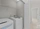 Laundry room showcasing a modern washer and dryer set with easy access to other rooms at 12516 Hennigan Place Ln, Charlotte, NC 28214