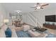 Staged open-concept living room with stylish furnishings and abundant light at 12516 Hennigan Place Ln, Charlotte, NC 28214