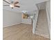 Open-concept living area with hardwood floors, staircase, and ample natural light at 12516 Hennigan Place Ln, Charlotte, NC 28214