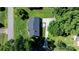 Aerial view of a well-maintained property with lush green lawn and mature trees at 135 Burton Hills Cir, Gastonia, NC 28054