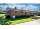 Brick home with a well-maintained lawn and back patio, perfect for entertaining at 135 Burton Hills Cir, Gastonia, NC 28054