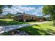 Traditional brick house with a well-kept lawn and a concrete driveway at 135 Burton Hills Cir, Gastonia, NC 28054