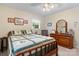Comfortable bedroom featuring a queen-size bed, dresser, and soft natural light at 135 Burton Hills Cir, Gastonia, NC 28054