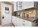 Well-lit kitchen features custom cabinetry, granite countertops, and stylish backsplash at 135 Burton Hills Cir, Gastonia, NC 28054