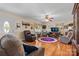 Inviting living room with hardwood floors, comfortable furniture, and a bright window view, creating a relaxing atmosphere at 135 Burton Hills Cir, Gastonia, NC 28054