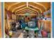 Organized shed interior with ample storage, tools, and lawn equipment at 135 Burton Hills Cir, Gastonia, NC 28054