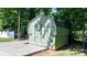 Well-maintained shed with double doors, adding extra storage space to the property at 135 Burton Hills Cir, Gastonia, NC 28054
