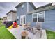 A fenced backyard with a patio, outdoor chairs, and play equipment at 150 Bezelle Ave, York, SC 29745