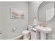 Stylish half-bathroom featuring a pedestal sink, modern fixtures, and tasteful decor at 150 Bezelle Ave, York, SC 29745