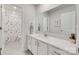 Modern bathroom featuring a white vanity, large mirror, and shower with floral curtain at 150 Bezelle Ave, York, SC 29745