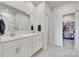 Elegant bathroom featuring double sinks, granite countertops, and a walk-in closet at 150 Bezelle Ave, York, SC 29745