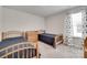 Shared bedroom with twin beds, a dresser, and a bright window at 150 Bezelle Ave, York, SC 29745