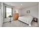 Bright bedroom featuring a wood dresser, neutral walls, plush carpet, and sunlit window at 150 Bezelle Ave, York, SC 29745
