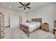 Another view of the bright bedroom with a ceiling fan and classic wooden furniture at 150 Bezelle Ave, York, SC 29745