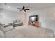 Bonus room featuring a TV, comfortable seating, and carpet flooring at 150 Bezelle Ave, York, SC 29745