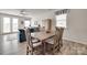 Cozy dining area adjacent to the living room featuring wood floors, and french doors at 150 Bezelle Ave, York, SC 29745