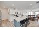 Open-concept kitchen featuring a center island with bar seating and a view to the dining room at 150 Bezelle Ave, York, SC 29745