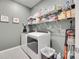 Laundry room featuring modern appliances and shelving at 150 Bezelle Ave, York, SC 29745
