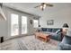 Comfortable living room with french doors, wood-look floors, area rug and ceiling fan at 150 Bezelle Ave, York, SC 29745