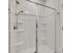 Clean shower with a showerhead and shelves in a well-lit bathroom at 150 Bezelle Ave, York, SC 29745