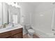 This bathroom features a shower-tub combo, a toilet, and a single sink with modern fixtures at 15209 Loire Valley St, Charlotte, NC 28277