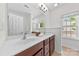 Bright bathroom featuring double sinks, ample counter space, and a large mirror, perfect for a busy household at 15209 Loire Valley St, Charlotte, NC 28277
