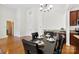 Dining room with dark wood table and chairs and easy access to the kitchen at 15209 Loire Valley St, Charlotte, NC 28277