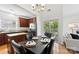 Dining room with table and chairs, adjacent to the kitchen and deck at 15209 Loire Valley St, Charlotte, NC 28277