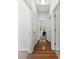 Bright hallway showcasing hardwood floors and doorways leading to various rooms at 15209 Loire Valley St, Charlotte, NC 28277