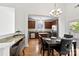 Modern eat-in kitchen features stainless steel appliances, granite countertops and island at 15209 Loire Valley St, Charlotte, NC 28277