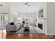 Bright living room with hardwood floors, fireplace, and large windows at 15209 Loire Valley St, Charlotte, NC 28277
