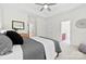 Comfortable main bedroom with soft carpet, tray ceilings, a ceiling fan, and natural light from the window at 15209 Loire Valley St, Charlotte, NC 28277