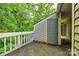 Balcony offers privacy with views of the natural canopy and an access door to storage at 1606 Sharon W Rd # 40, Charlotte, NC 28210