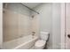 Cozy bathroom featuring a tiled shower-tub combo and modern toilet at 1606 Sharon W Rd # 40, Charlotte, NC 28210
