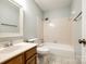 Bathroom with vanity, toilet, shower, tub, and fixtures at 1606 Sharon W Rd # 40, Charlotte, NC 28210