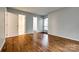 Bright bedroom featuring hardwood floors, neutral paint, and natural light from the window at 1606 Sharon W Rd # 40, Charlotte, NC 28210