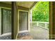 Front door and deck surrounded by trees at 1606 Sharon W Rd # 40, Charlotte, NC 28210