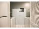 Bright laundry area with side by side washer and dryer, tiled floor, and access door at 1606 Sharon W Rd # 40, Charlotte, NC 28210