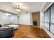 Cozy living room featuring a fireplace, hardwood floors, and natural light from large windows at 1606 Sharon W Rd # 40, Charlotte, NC 28210