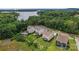 Waterfront homes featuring well-maintained lawns, private decks, and lush surroundings, near a tranquil lake at 17231 Rider Wood Ln, Charlotte, NC 28278