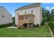 Charming home featuring a backyard with a spacious patio and wooden deck, ideal for relaxing and entertaining at 17231 Rider Wood Ln, Charlotte, NC 28278