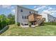 Charming home showcasing a backyard with a spacious patio and a wooden deck, perfect for outdoor living at 17231 Rider Wood Ln, Charlotte, NC 28278