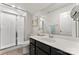 Clean bathroom with a glass-enclosed shower, modern vanity, and a spacious mirror at 17231 Rider Wood Ln, Charlotte, NC 28278