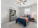 Comfortable bedroom showcases a charming hutch, plush carpeting, and a brightly lit window at 17231 Rider Wood Ln, Charlotte, NC 28278
